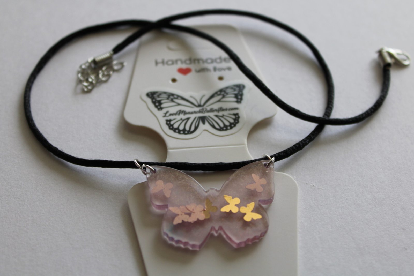 HM butterfly pink butterfly resin necklace